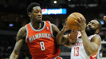 Feb 8, 2014; Milwaukee, WI, USA; Houston Rockets guard James Harden (13) drives for the basket against Milwaukee Bucks center Larry Sanders (8) in the first quarter at BMO Harris Bradley Center. Mandatory Credit: Benny Sieu-USA TODAY Sports