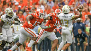 Clemson defensive tackle Tyler Davis (13) and defensive lineman Bryan Bresee (11) pressures Georgia Tech freshman Jordan Yates (13) during the second quarter in Clemson, S.C., September 18, 2021.Ncaa Football Georgia Tech At Clemson(PHOTO COURTESY OF IMAGN)