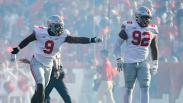 Ohio State Buckeyes defensive end Zach Harrison (9) pioints to teammate Ohio State Buckeyes defensive tackle Haskell Garrett (92) after Garrett blocked a point-after-touchdown attempt for Rutgers during the first quarter of a NCAA Division I football game between the Rutgers Scarlet Knights and the Ohio State Buckeyes on Saturday, Oct. 2, 2021 at SHI Stadium in Piscataway, New Jersey.Cfb Ohio State Buckeyes At Rutgers Scarlet Knights