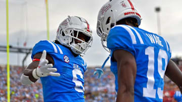OXFORD, MISSISSIPPI - OCTOBER 15: Zach Evans #6 of the Mississippi Rebels and Dayton Wade #19 of the Mississippi Rebels celebrate during the first half against the Auburn Tigers at Vaught-Hemingway Stadium on October 15, 2022 in Oxford, Mississippi. (Photo by Justin Ford/Getty Images)