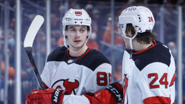 Jack Hughes #86 and Ty Smith #24 of the New Jersey Devils. (Photo by Tim Nwachukwu/Getty Images)
