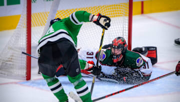 Dec 6, 2021; Dallas, Texas, USA; Dallas Stars left wing Jamie Benn (14) scores his second goal of the night on Arizona Coyotes goaltender Scott Wedgewood (31) during the third period at the American Airlines Center. Mandatory Credit: Jerome Miron-USA TODAY Sports