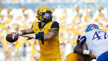 MORGANTOWN, WV - OCTOBER 06: Will Grier #7 of the West Virginia Mountaineers throws a pass against the Kansas Jayhawks in the first quarter of the game at Mountaineer Field on October 6, 2018 in Morgantown, West Virginia. (Photo by Joe Robbins/Getty Images)