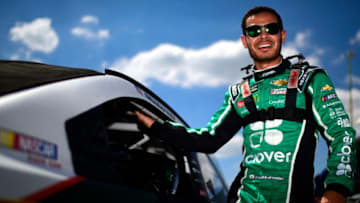 DARLINGTON, SOUTH CAROLINA - AUGUST 31: Kyle Larson, driver of the #42 Clover Chevrolet, climbs into his car during qualifying for the Monster Energy NASCAR Cup Series Bojangles' Southern 500 at Darlington Raceway on August 31, 2019 in Darlington, South Carolina. (Photo by Jared C. Tilton/Getty Images)