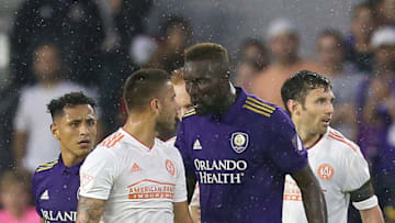 ORLANDO, FL - MAY 13: Hector Villalba #15 of Atlanta United FC and Lamine Sane #22 of Orlando City SC exchange words in a heated argument during a MLS soccer match at Orlando City Stadium on May 13, 2018 in Orlando, Florida. (Photo by Alex Menendez/Getty Images)