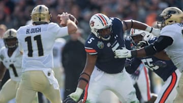 Auburn football defensive lineman Derrick Brown (5) fights through the line during the Music City Bowl at Nissan Stadium in Nashville, Tenn., on Friday, Dec. 28, 2018. Auburn defeated Purdue 63-14.Jc Auburnmcb 64