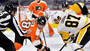 May 4, 2021; Philadelphia, Pennsylvania, USA; Philadelphia Flyers center Claude Giroux (28) and Pittsburgh Penguins center Sidney Crosby (87) face-off at Wells Fargo Center. Mandatory Credit: Eric Hartline-USA TODAY Sports