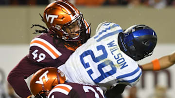 BLACKSBURG, VA - OCTOBER 28: Linebacker Tremaine Edmunds #49 and safety Reggie Floyd #21 of the Virginia Tech Hokies tackle running back Shaun Wilson #29 of the Duke Blue Devils in the first half at Lane Stadium on October 28, 2017 in Blacksburg, Virginia. (Photo by Michael Shroyer/Getty Images)