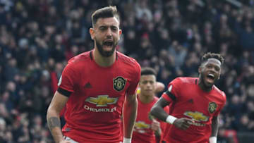 Manchester United's Portuguese midfielder Bruno Fernandes celebrates scoring the opening goal from the penalty spot during the English Premier League football match between Manchester United and Watford at Old Trafford in Manchester, north west England, on February 23, 2020. (Photo by Paul ELLIS / AFP) / RESTRICTED TO EDITORIAL USE. No use with unauthorized audio, video, data, fixture lists, club/league logos or 'live' services. Online in-match use limited to 120 images. An additional 40 images may be used in extra time. No video emulation. Social media in-match use limited to 120 images. An additional 40 images may be used in extra time. No use in betting publications, games or single club/league/player publications. / (Photo by PAUL ELLIS/AFP via Getty Images)