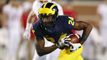 ANN ARBOR, MI - OCTOBER 13: Lavert Hill #24 of the Michigan Wolverines intercepts a second half pass and returns is for a touchdown while playing the Wisconsin Badgers on October 13, 2018 at Michigan Stadium in Ann Arbor, Michigan. (Photo by Gregory Shamus/Getty Images)