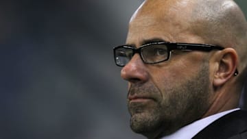ARNHEM, NETHERLANDS - MARCH 16: Heracles Almelo Manager / Coach, Peter Bosz looks on during the Eredivisie match between Vitesse Arnhem and SC Heracles Almelo at Gelredome on March 16, 2012 in Arnhem, Netherlands. (Photo by Dean Mouhtaropoulos/Getty Images)