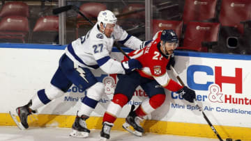 SUNRISE, FL - DECEMBER 10: Vincent Trocheck #21 of the Florida Panthers skates with the puck against Ryan McDonagh #27 of the Tampa Bay Lightning at the BB&T Center on December 10, 2019 in Sunrise, Florida. (Photo by Eliot J. Schechter/NHLI via Getty Images)