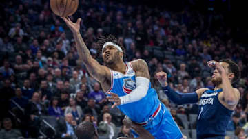 Sacramento Kings guard Frank Mason III (10) makes a basket as he's fouled by the Minnesota Timberwolves center Gorgui Dieng (5) in the first quarter at the Golden 1 Center in Sacramento, Calif. on Monday, Feb. 26, 2018. (Hector Amezcua/Sacramento Bee/TNS via Getty Images)