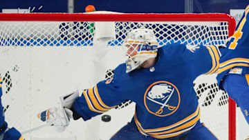 BUFFALO, NY - FEBRUARY 15: Brock Nelson #29 of the New York Islanders , scores a goal against Linus Ullmark #35 of the Buffalo Sabres during the second period at KeyBank Center on February 15, 2021 in Buffalo, New York. (Photo by Kevin Hoffman/Getty Images)