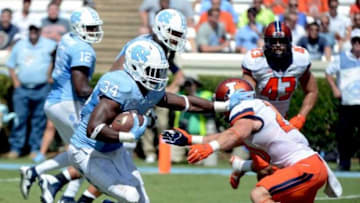 Sep 19, 2015; Chapel Hill, NC, USA; North Carolina Tar Heels running back Elijah Hood (34) runs the ball during the first half against the Illinois Fighting Illini at Kenan Memorial Stadium. Mandatory Credit: Rob Kinnan-USA TODAY Sports