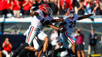 Oct 30, 2021; Jacksonville, Florida, USA; Georgia Bulldogs linebacker Nolan Smith (4) reacts after intercepting the ball in the first half against the Florida Gators at TIAA Bank Field. Mandatory Credit: Nathan Ray Seebeck-USA TODAY Sports