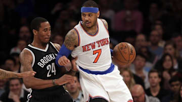Apr 1, 2016; New York, NY, USA; New York Knicks forward Carmelo Anthony (7) defended by Brooklyn Nets guard Rondae Hollis-Jefferson (24) during the second half at Madison Square Garden. The Knicks defeated the Nets 105-91. Mandatory Credit: Adam Hunger-USA TODAY Sports