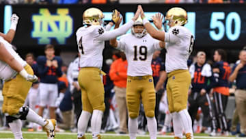 Oct 1, 2016; East Rutherford, NJ, USA; Notre Dame Fighting Irish holder Montgomery VanGorder (4) kicker Justin Yoon (19) and long snapper Scott Daly (61) celebrate after a field goal in the fourth quarter agains the Syracuse Orange at MetLife Stadium. Notre Dame won 50-33. Mandatory Credit: Matt Cashore-USA TODAY Sports