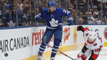 TORONTO, ON - FEBRUARY 10: Colin White #36 of the Ottawa Senators skates to check Nikita Zaitsev #22 of the Toronto Maple Leafs during an NHL game at the Air Canada Centre on February 10, 2018 in Toronto, Ontario, Canada. (Photo by Claus Andersen/Getty Images)