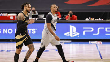 TAMPA, FLORIDA - MARCH 28: Norman Powell #24 of the Portland Trail Blazers and Gary Trent Jr. #33 of the Toronto Raptors walk on the court during the fourth quarter at Amalie Arena on March 28, 2021 in Tampa, Florida. NOTE TO USER: User expressly acknowledges and agrees that, by downloading and or using this photograph, User is consenting to the terms and conditions of the Getty Images License Agreement. (Photo by Douglas P. DeFelice/Getty Images)