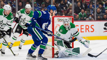 Apr 18, 2022; Vancouver, British Columbia, CAN; Vancouver Canucks forward Elias Pettersson (40) scores on Dallas Stars goalie Jake Oettinger (29) in the first period at Rogers Arena. Mandatory Credit: Bob Frid-USA TODAY Sports