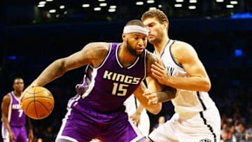 Nov 27, 2016; Brooklyn, NY, USA; Sacramento Kings center center DeMarcus Cousins (15) dribbles the ball as Brooklyn Nets center Brook Lopez (11) defends during the first half at Barclays Center. Mandatory Credit: Andy Marlin-USA TODAY Sports