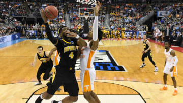 COLUMBUS, OH - MARCH 24: Isaiah Moss #4 of the Iowa Hawkeyes shoots over Jordan Bowden #23 of Tennessee Volunteers in the second round of the 2019 NCAA Men's Basketball Tournament held at Nationwide Arena on March 24, 2019 in Columbus, Ohio. (Photo by Jamie Schwaberow/NCAA Photos via Getty Images)