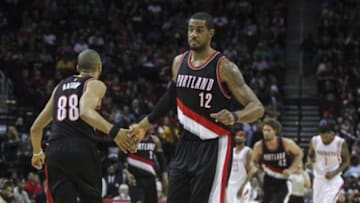 Feb 8, 2015; Houston, TX, USA; Portland Trail Blazers forward LaMarcus Aldridge (12) is congratulated by forward Nicolas Batum (88) after making a basket during the second quarter against the Houston Rockets at Toyota Center. Mandatory Credit: Troy Taormina-USA TODAY Sports