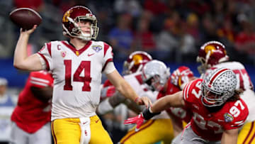 ARLINGTON, TX - DECEMBER 29: Sam Darnold #14 of the USC Trojans looks for an open receiver against Nick Bosa #97 of the Ohio State Buckeyes during the Goodyear Cotton Bowl Classic at AT&T Stadium on December 29, 2017 in Arlington, Texas. (Photo by Tom Pennington/Getty Images)
