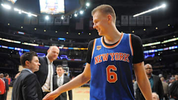 December 11, 2016; Los Angeles, CA, USA; New York Knicks forward Kristaps Porzingis (6) celebrates the 118-112 victory against the Los Angeles Lakers at Staples Center. Mandatory Credit: Gary A. Vasquez-USA TODAY Sports