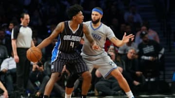 Apr 15, 2015; Brooklyn, NY, USA; Orlando Magic guard Elfrid Payton (4) drives against Brooklyn Nets guard Deron Williams (8) during the third quarter at Barclays Center. Brooklyn Nets won 101-88. Mandatory Credit: Anthony Gruppuso-USA TODAY Sports