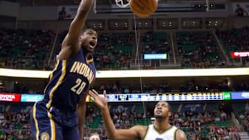 Dec 5, 2015; Salt Lake City, UT, USA; Indiana Pacers center Ian Mahinmi (28) dunks the ball over Utah Jazz forward Derrick Favors (15) during the second half at Vivint Smart Home Arena. The Jazz won in overtime 122-119. Mandatory Credit: Russ Isabella-USA TODAY Sports