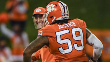 Clemson head coach Dabo Swinney smiles with Clemson defensive tackle Jordan Williams(59) after the Tigers beat Virginia 41-23 Saturday, October 3, 2020 at Memorial Stadium in Clemson, S.C.Clemson Virginia Ncaa Football