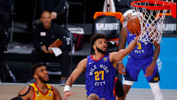 LAKE BUENA VISTA, FLORIDA - AUGUST 30: Jamal Murray #27 of the Denver Nuggets goes up for a shot against the Utah Jazz during the first quarter in Game Six of the Western Conference First Round during the 2020 NBA Playoffs at AdventHealth Arena at ESPN Wide World Of Sports Complex on August 30, 2020 in Lake Buena Vista, Florida. NOTE TO USER: User expressly acknowledges and agrees that, by downloading and or using this photograph, User is consenting to the terms and conditions of the Getty Images License Agreement. (Photo by Kevin C. Cox/Getty Images)