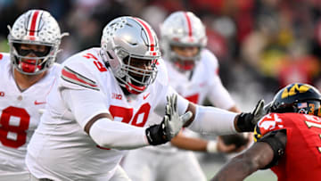 COLLEGE PARK, MARYLAND - NOVEMBER 19: Dawand Jones #79 of the Ohio State Buckeyes blocks against the Maryland Terrapins at SECU Stadium on November 19, 2022 in College Park, Maryland. (Photo by G Fiume/Getty Images)