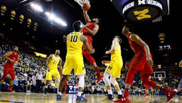 Jan 7, 2017; Ann Arbor, MI, USA; Maryland Terrapins forward Damonte Dodd (35) dunks on Michigan Wolverines guard Derrick Walton Jr. (10) in the second half at Crisler Center. Maryland won 77-70. Mandatory Credit: Rick Osentoski-USA TODAY Sports