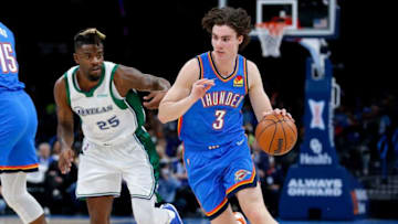 OKC Thunder rookie Josh Giddey (3) drives to the basket as Dallas' Reggie Bullock (25)Thunder Mav