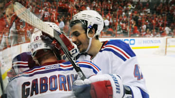 Marian Gaborik #10 of the New York Rangers celebrates with his teammates after scoring the game winning goal in the third overtime period. (Photo by Patrick McDermott/Getty Images)