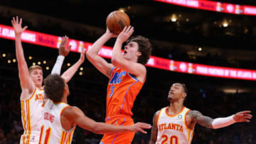 Josh Giddey #3 of the Oklahoma City Thunder attacks the basket against John Collins #20, Trae Young #11, and Kevin Huerter #3 of the Atlanta Hawksduring the first half at State Farm Arena on November 22, 2021 in Atlanta, Georgia. NOTE TO USER: User expressly acknowledges and agrees that, by downloading and or using this photograph, User is consenting to the terms and conditions of the Getty Images License Agreement. (Photo by Kevin C. Cox/Getty Images)
