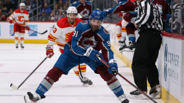 Mar 13, 2022; Denver, Colorado, USA; Colorado Avalanche center Nazem Kadri (91) controls the puck in the second period against the Calgary Flames at Ball Arena. Mandatory Credit: Isaiah J. Downing-USA TODAY Sports