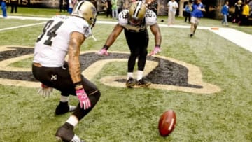 Oct 5, 2014; New Orleans, LA, USA; New Orleans Saints running back Khiry Robinson (29) celebrates his game winning touchdown with wide receiver Kenny Stills (84) in overtime of a game at Mercedes-Benz Superdome. The Saints defeated the Buccaneers 37-31 in overtime. Mandatory Credit: Derick E. Hingle-USA TODAY Sports