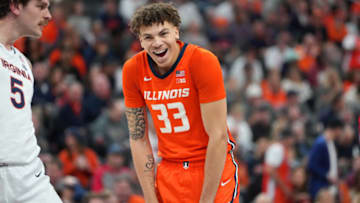 Nov 20, 2022; Las Vegas, Nevada, USA; Illinois Fighting Illini forward Coleman Hawkins (33) reacts during a free throw attempt against the Virginia Cavaliers during the first half at T-Mobile Arena. Mandatory Credit: Stephen R. Sylvanie-USA TODAY Sports