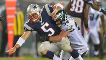 PHILADELPHIA, PA - AUGUST 09: Jake Knott #54 of the Philadelphia Eagles hits Tim Tebow #5 of the New England Patriots at Lincoln Financial Field on August 9, 2013 in Philadelphia, Pennsylvania. The Patriots won 31-22. (Photo by Drew Hallowell/Philadelphia Eagles/Getty Images)