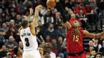 Jan 20, 2016; Portland, OR, USA; Portland Trail Blazers guard C.J. McCollum (3) has his shot blocked by Atlanta Hawks center Al Horford (15) during the fourth quarter of the game at Moda Center at the Rose Quarter. The Hawks won the game 104-98. Mandatory Credit: Steve Dykes-USA TODAY Sports