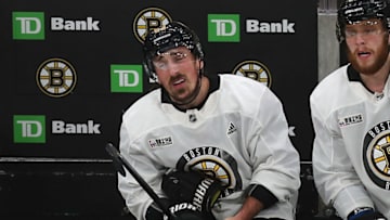 BOSTON, MA - MAY 23: Boston Bruins' Brad Marchand has left glove off in pain on the bench during the first period of a scrimmage ahead of the start of the 2019 NHL Stanley Cup Finals at TD Garden in Boston on May 23, 2019. (Photo by John Tlumacki/The Boston Globe via Getty Images)