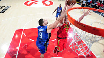 ATLANTA, GA - DECEMBER 9: Nikola Vucevic #9 of the Orlando Magic blocks a shot against the Atlanta Hawks on December 9, 2017 at Philips Arena in Atlanta, Georgia. NOTE TO USER: User expressly acknowledges and agrees that, by downloading and/or using this photograph, user is consenting to the terms and conditions of the Getty Images License Agreement. Mandatory Copyright Notice: Copyright 2017 NBAE (Photo by Scott Cunningham/NBAE via Getty Images)