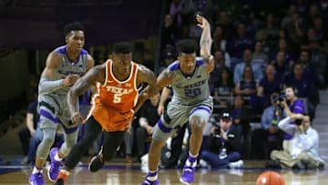 Dec 30, 2016; Manhattan, KS, USA; Kansas State Wildcats forward Zavier Sneed (20) and Texas Longhorns guard Kendal Yancy (5) battle for the ball during first half at Fred Bramlage Coliseum. Mandatory Credit: Scott Sewell-USA TODAY Sports