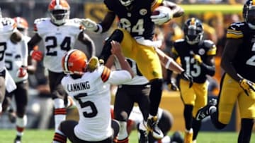 Sep 7, 2014; Pittsburgh, PA, USA; Pittsburgh Steelers wide receiver Antonio Brown (84) runs over Cleveland Browns punter Spencer Lanning (5) during the first half at Heinz Field. Brown was flagged on the play. Mandatory Credit: Jason Bridge-USA TODAY Sports