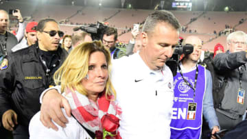 Jan 1, 2019; Pasadena, CA, USA; Ohio State Buckeyes head coach Urban Meyer and wife Shelley Meyer walk off the field after the 2019 Rose Bowl against the Washington Huskies at the Rose Bowl. Ohio State defeated Washington 28-23. Mandatory Credit: Kirby Lee-USA TODAY Sports