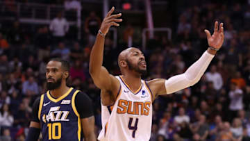 PHOENIX, ARIZONA - OCTOBER 28: Jevon Carter #4 of the Phoenix Suns reacts to the crowd ahead of Mike Conley #10 of the Utah Jazz during the second half of the NBA game at Talking Stick Resort Arena on October 28, 2019 in Phoenix, Arizona. The Jazz defeated the Suns 96-95. NOTE TO USER: User expressly acknowledges and agrees that, by downloading and/or using this photograph, user is consenting to the terms and conditions of the Getty Images License Agreement (Photo by Christian Petersen/Getty Images)